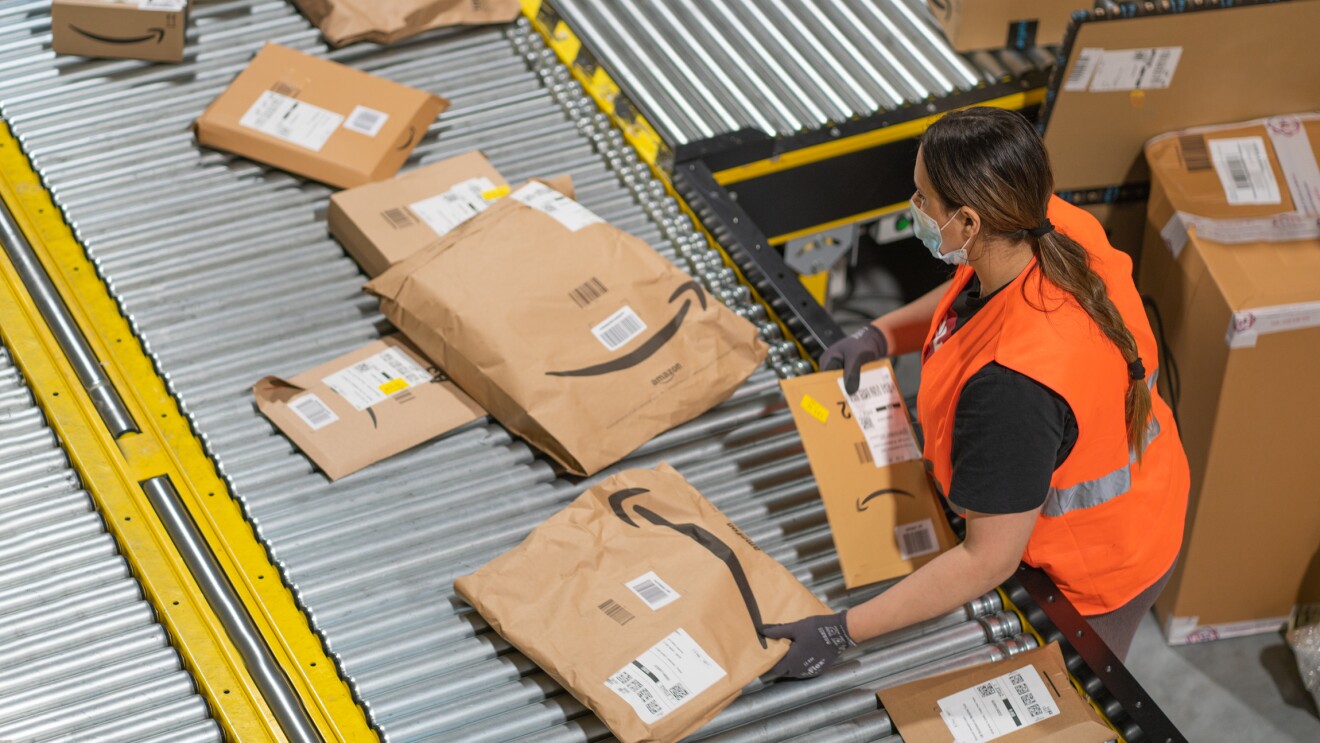 Photos of Amazon associates working in a Fulfillment Center in France.