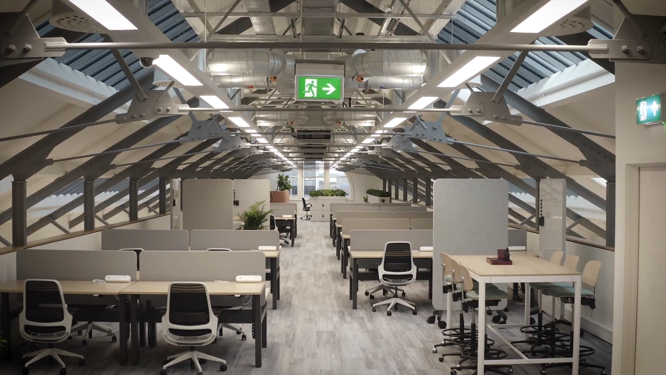 Inside the Amazon Manchester office, showing rows of desks on the top floor