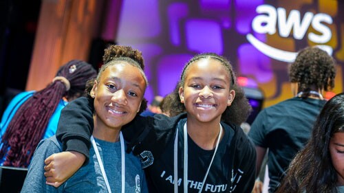 AWS Girls in Tech event with young girls smiling