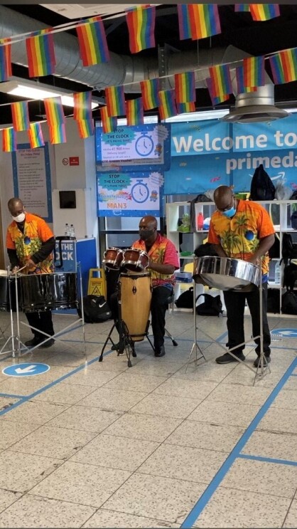 three men in a Calypso Band at amazon fulfilment centre in Bolton