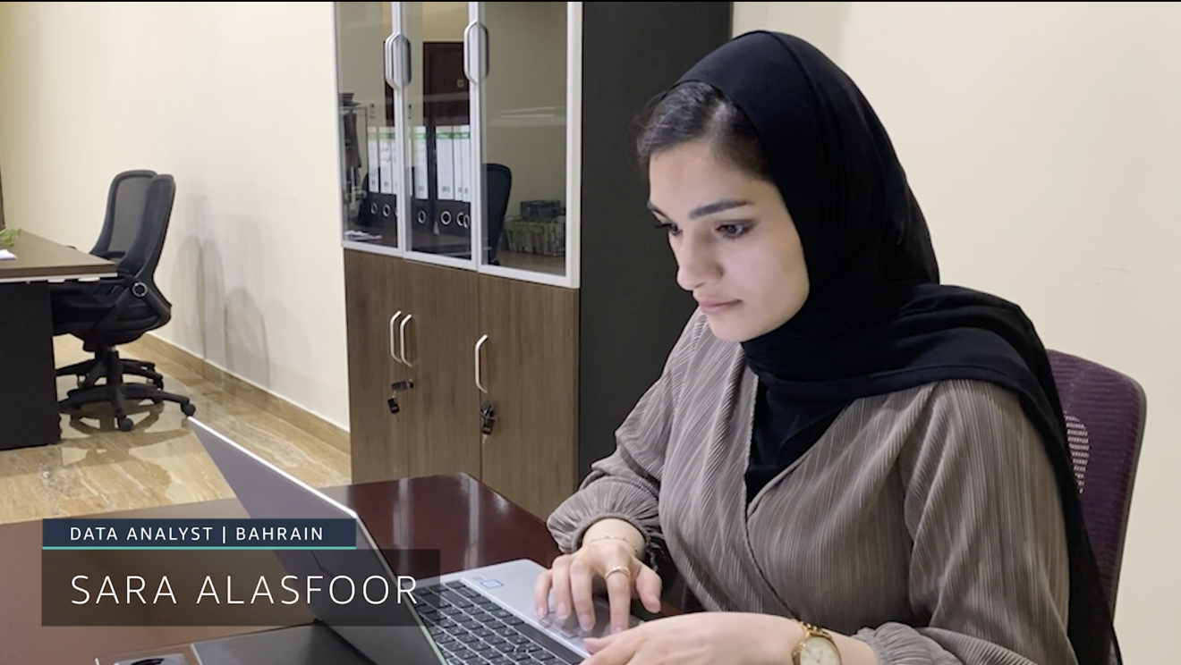 Young woman working on her laptop, signed Sara Alasfoor, Data analyst from Bahrain.