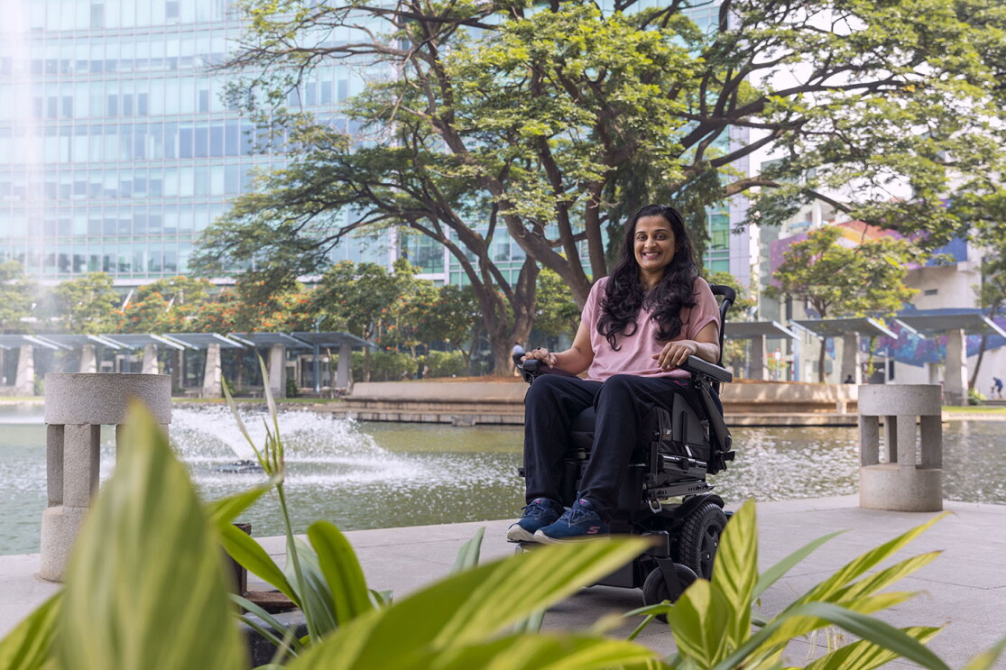 Mrunmaiy Abroal smiles for a photo in front of the Amazon building in Bangalore, India. 
