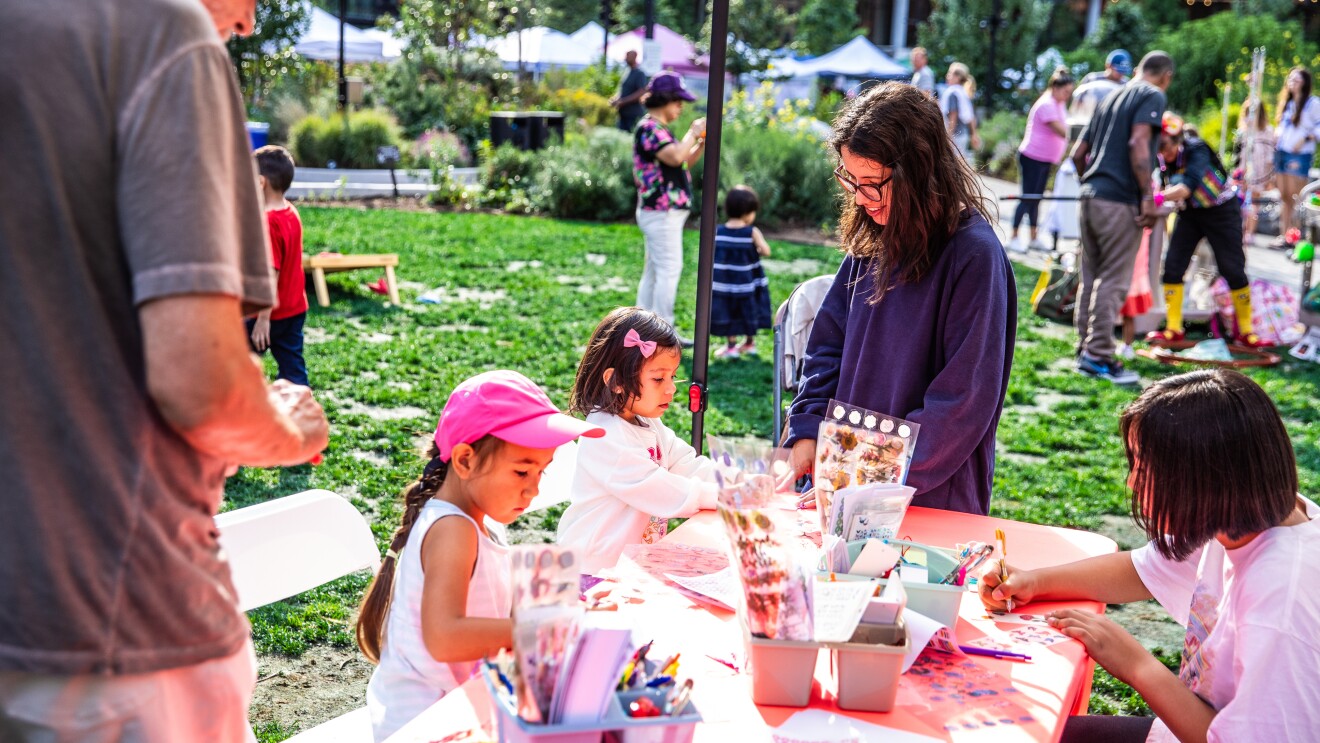Amazon's HQ2 Community Day: Children participating in outdoor arts and crafts activity at community event
