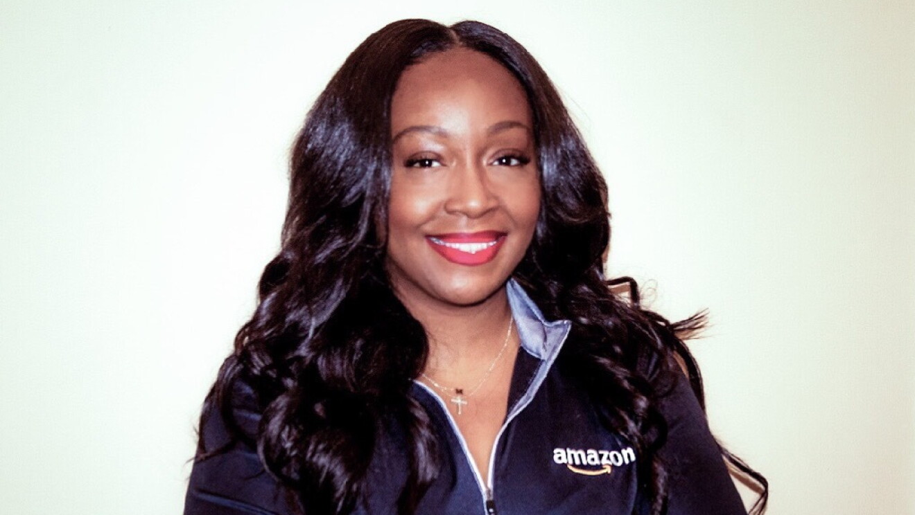 An image of an Amazon recruiter looking at the camera for a photo.