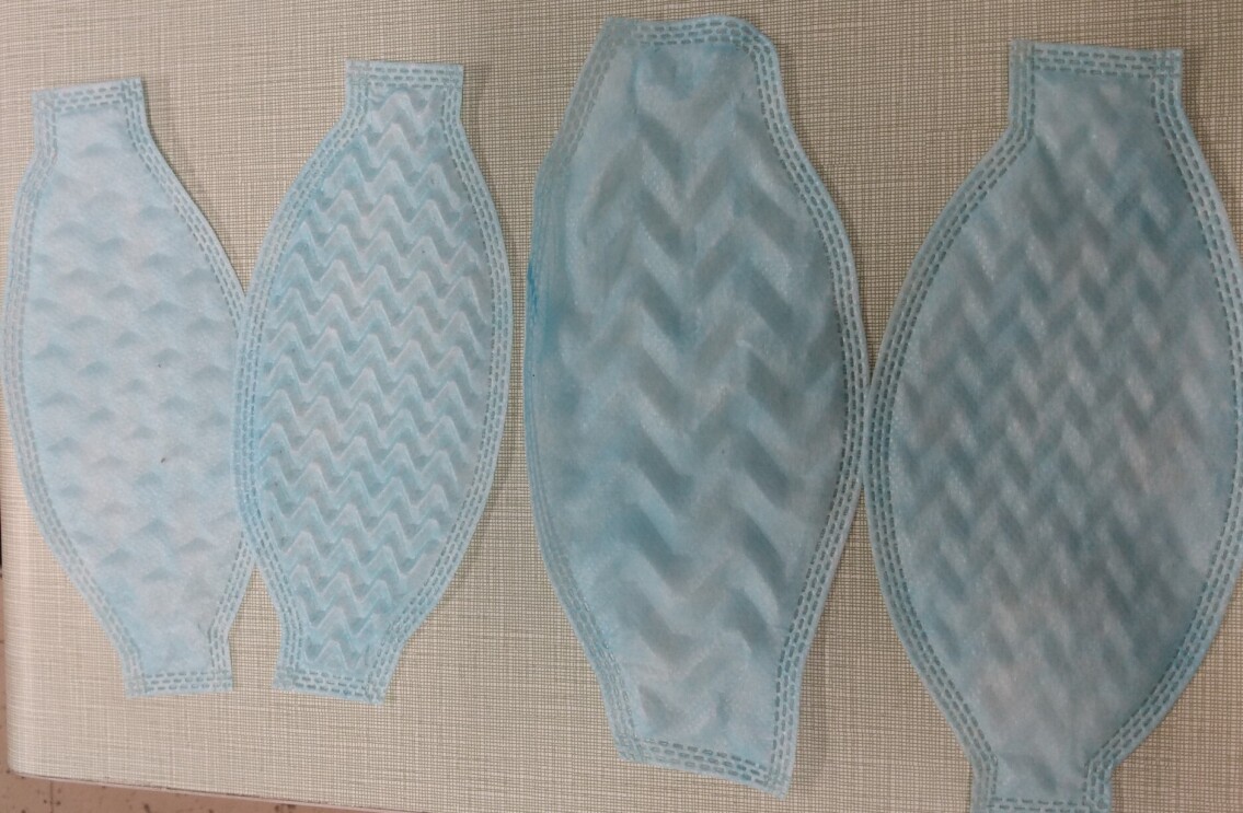 Four different mask prototypes lay side-by-side.