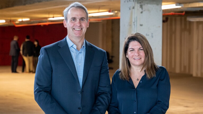 An image of a man and a woman smiling.