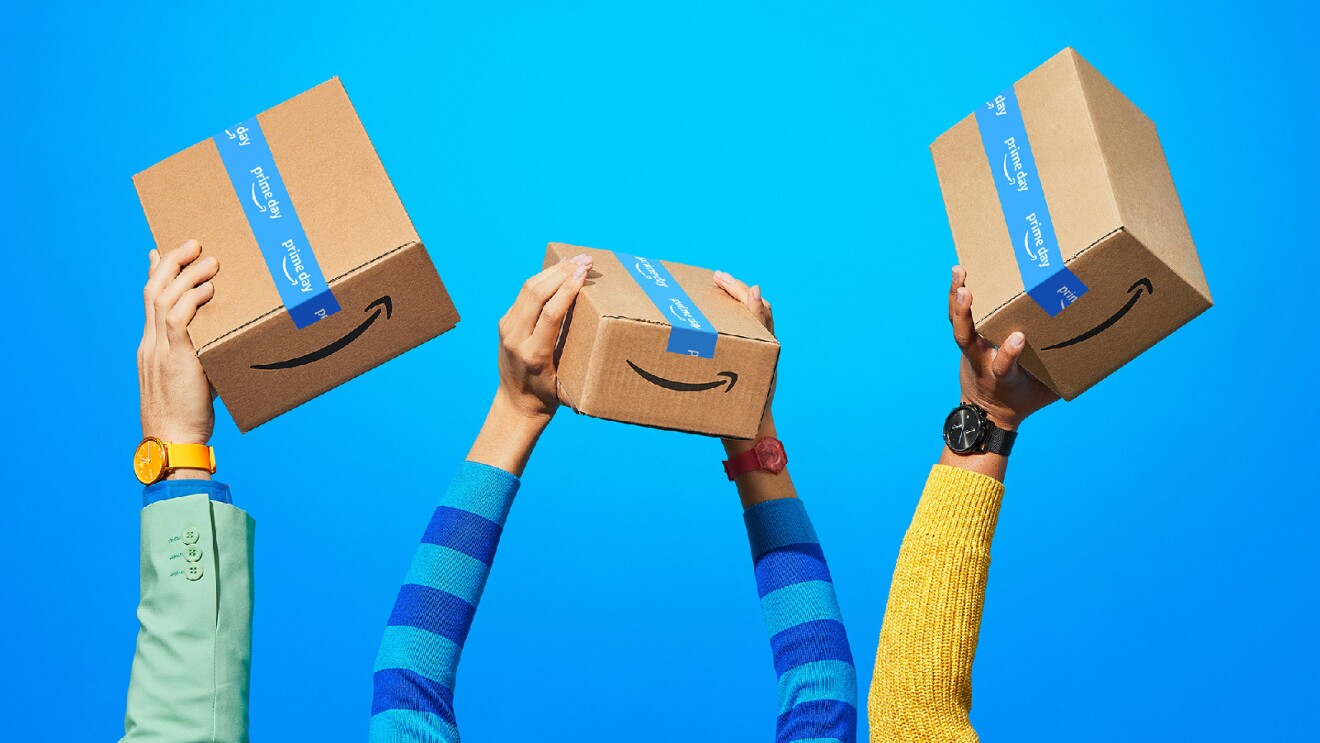 Prime Day 2023 live blog best deals: hands holding up Amazon boxes.