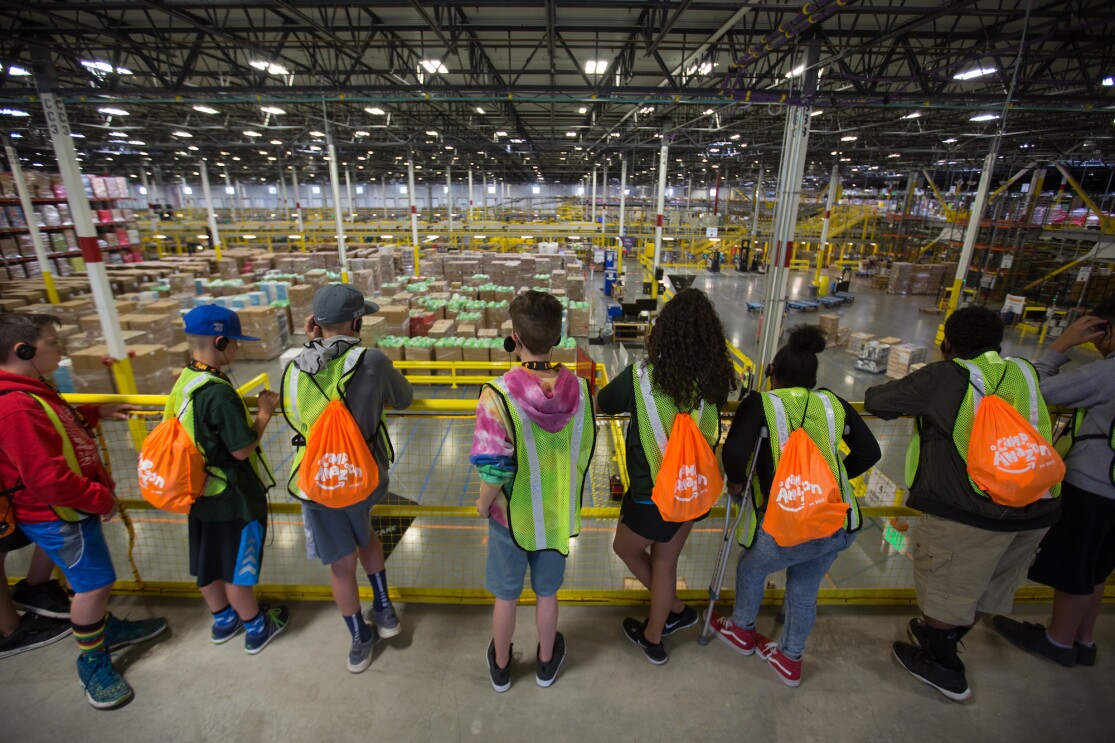 Students participate in a Camp Amazon event at a fulfillment center in Washington