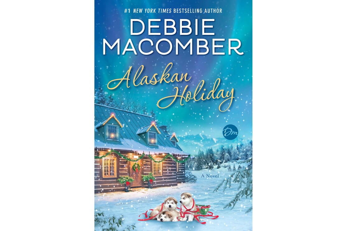 "Alaskan Holiday " book cover, shows a cozy cabin with festive lighting, in front of the house sit three husky dugs, cuddled together on a blanket of snow. Snow falls gently around the home and dogs.