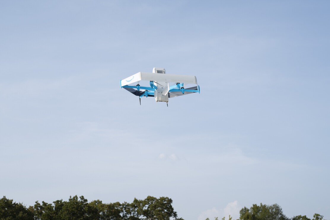 An image of an Amazon Drone in the sky. 