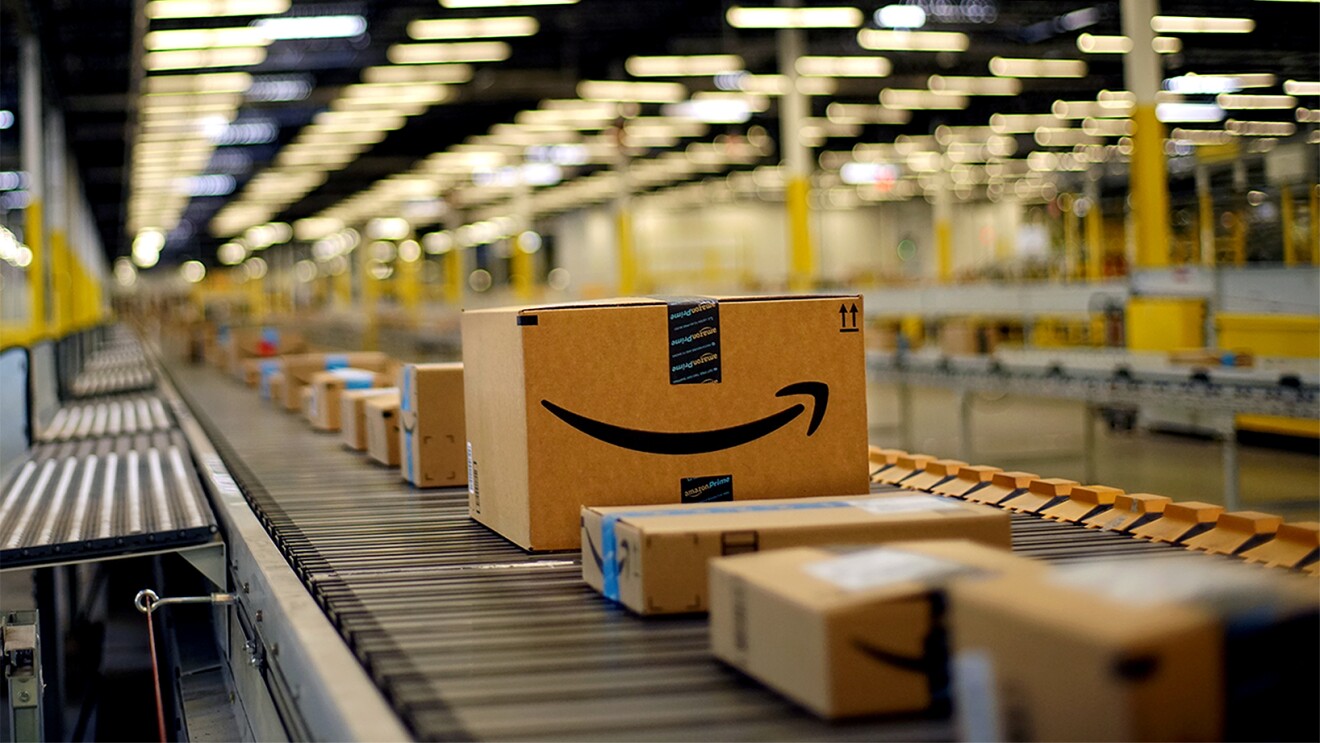 Boxes on a conveyor belt at a fulfillment center in Tracy, CA.