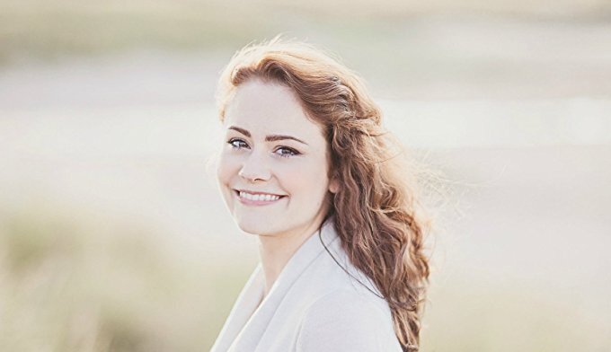 A portrait of Louise Ross smiling at the camera