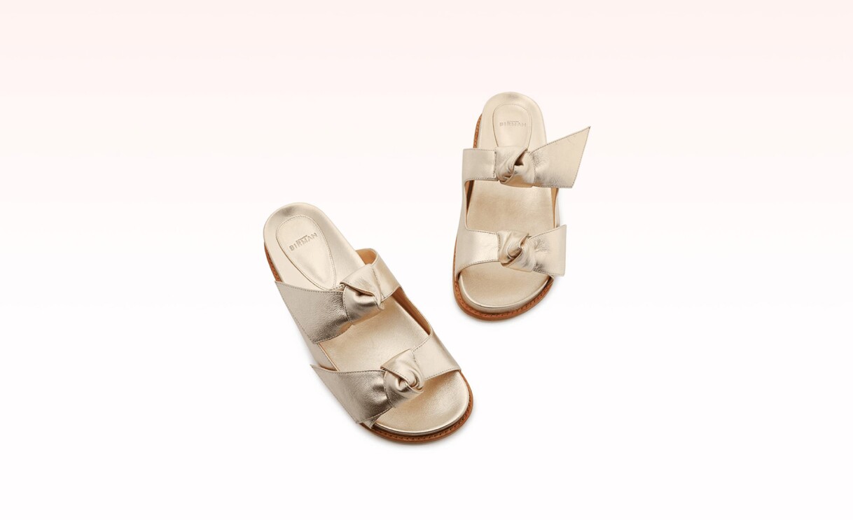 An image of gold sandals by Alexandre Birman.