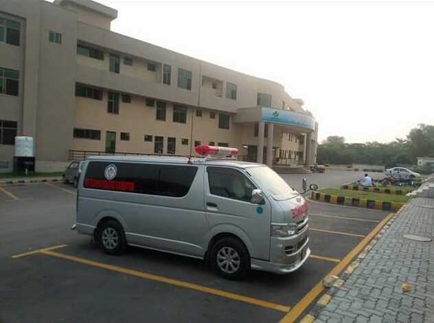Junaid Hussain's ambulance in a parking lot.