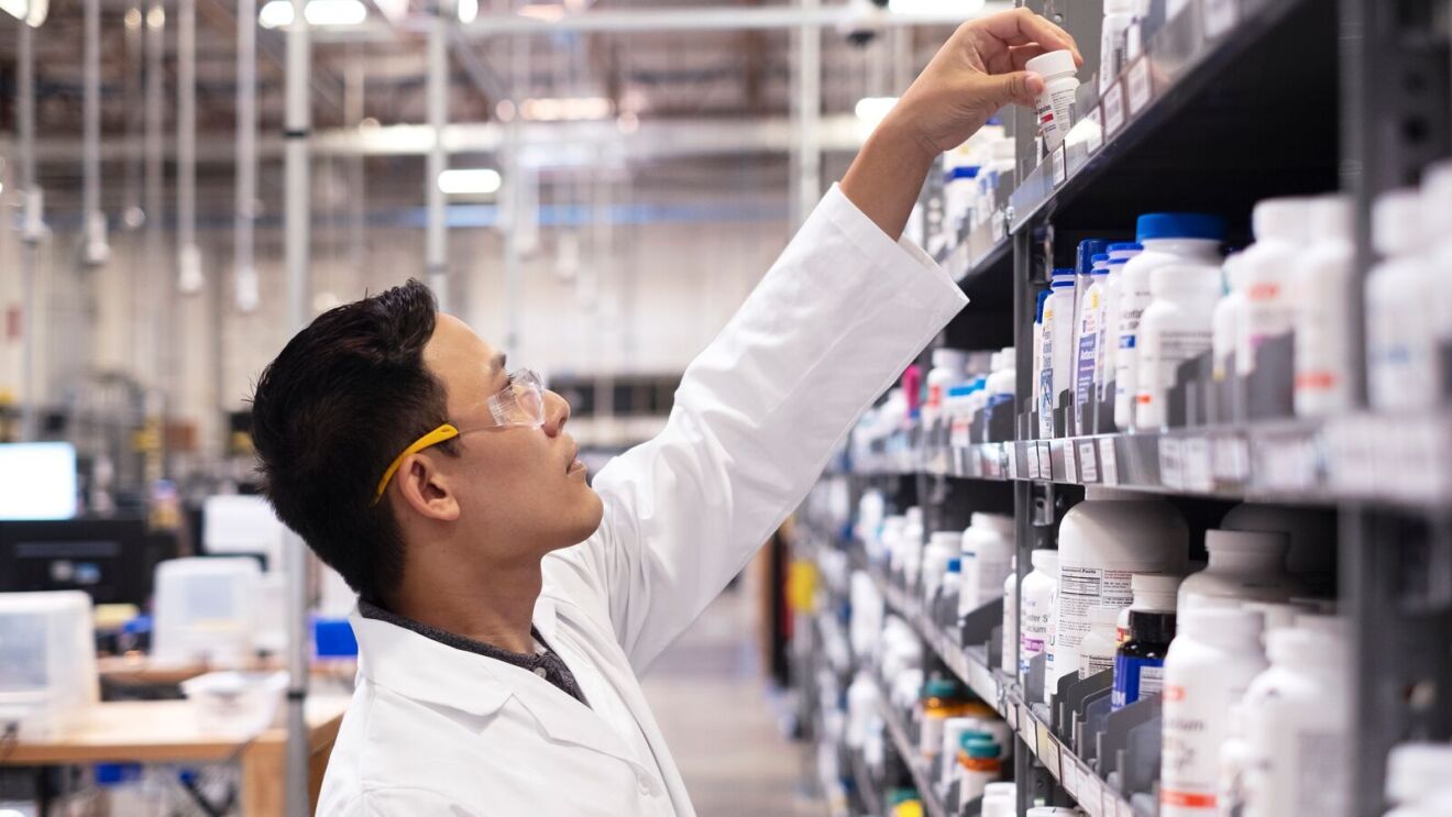 Pharmacist verifying medication labels and stock