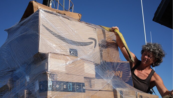 Amazon packages travel by boat, vehicle, and are delivered directly to customers.