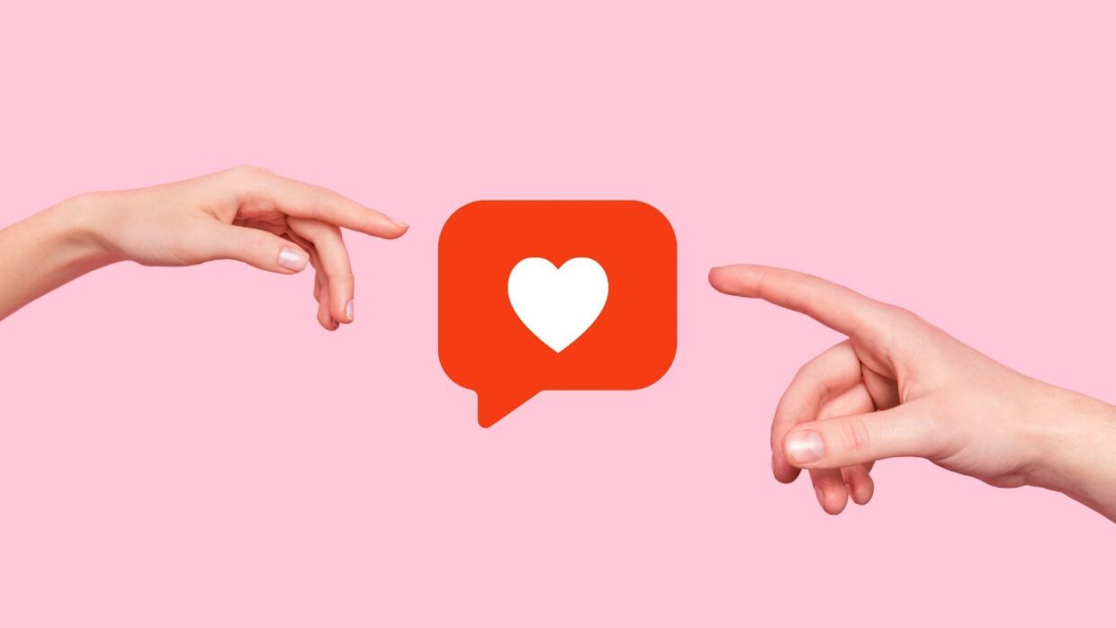 An image of two hands coming from opposite directions, pointing towards a social media heart in the centre.