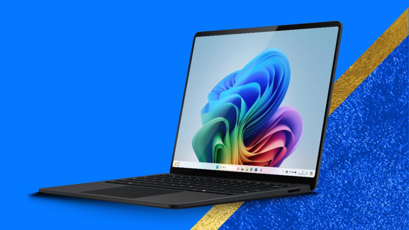 Laptop displaying colorful Windows 11 wallpaper on vibrant blue background