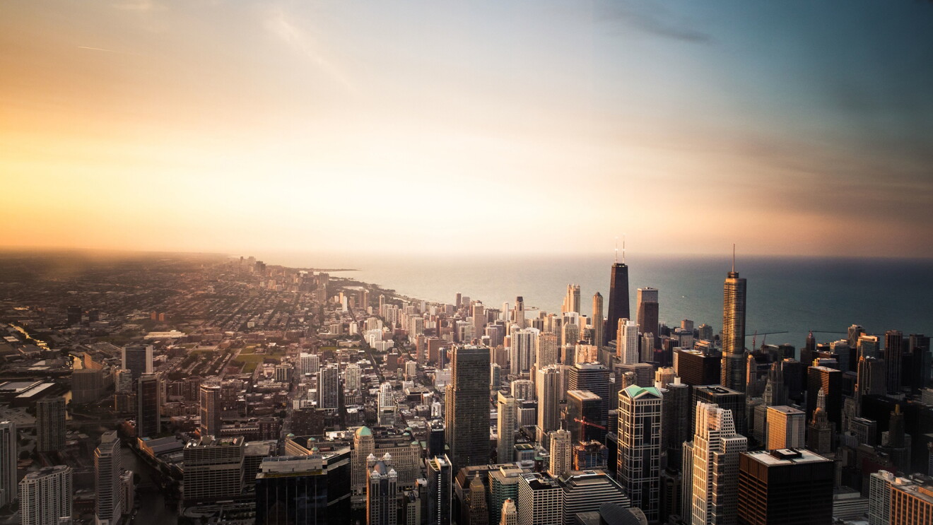 The Chicago Loop skyline with Lake Michigan and sunset background