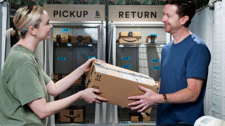 Customer returning Amazon package at a return location