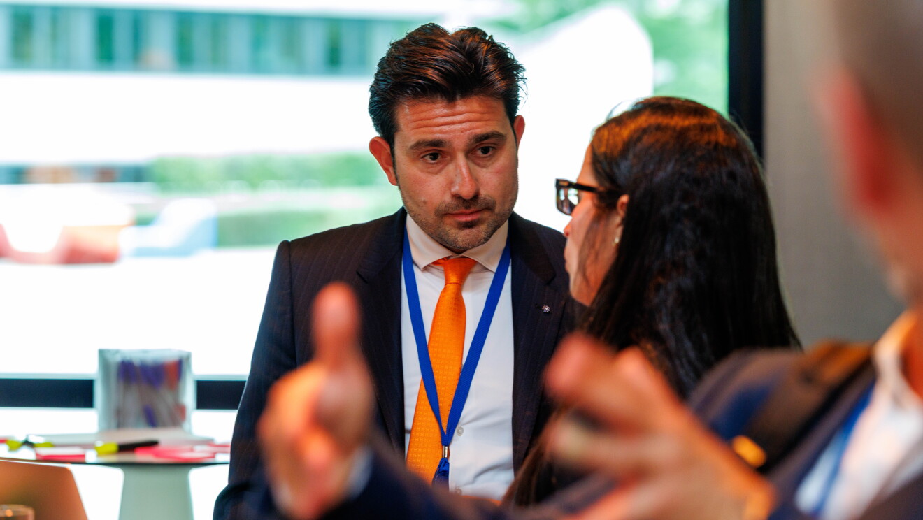 People talking to each other at a business event. 