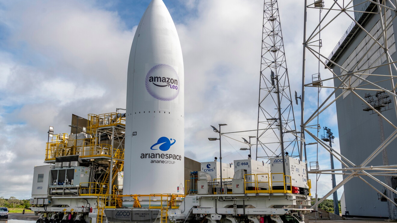 An Amazon Leo satellite standing upright at a space center 