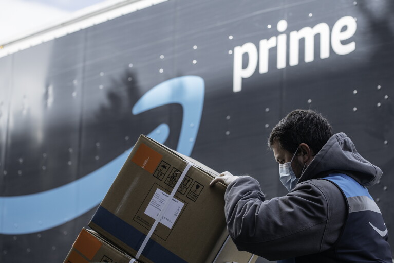 An Amazon driver delivers boxes of medical supplies.