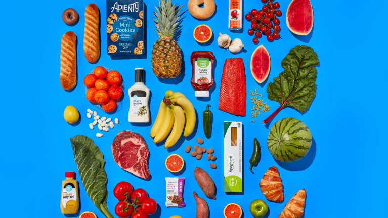 An image of a variety of food items laid out and displayed against a blue background.