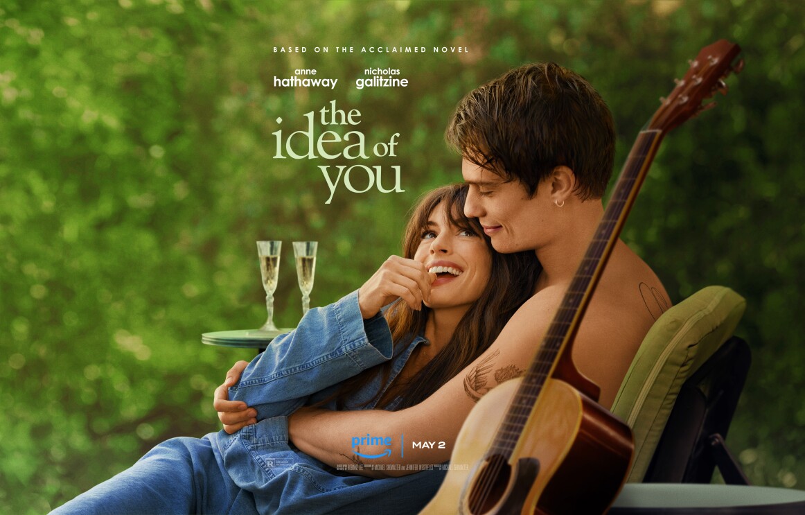 A man and a woman are sitting on a chair and looking at each other lovingly