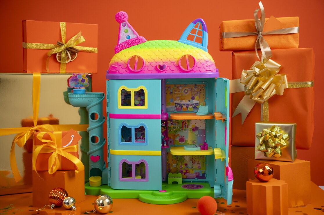 SpinMaster Gabby’s Dollhouse surrounded by Christmas packaging 