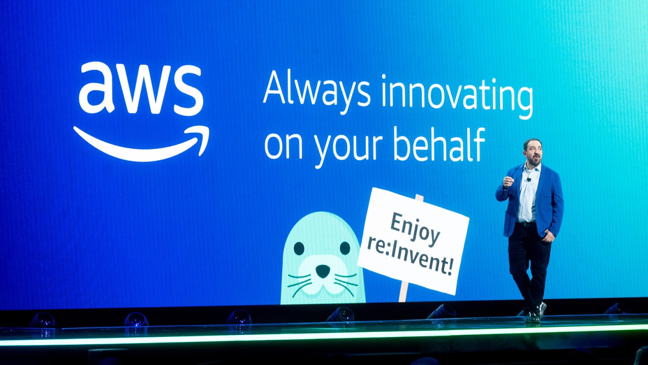 A photo of Peter DeSantis, senior vice president of AWS Utility Computing, speaking on stage at AWS re:Invent 2023.
