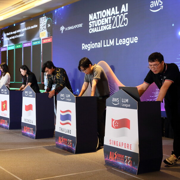 ASEAN LLM League - Participants coding on stage