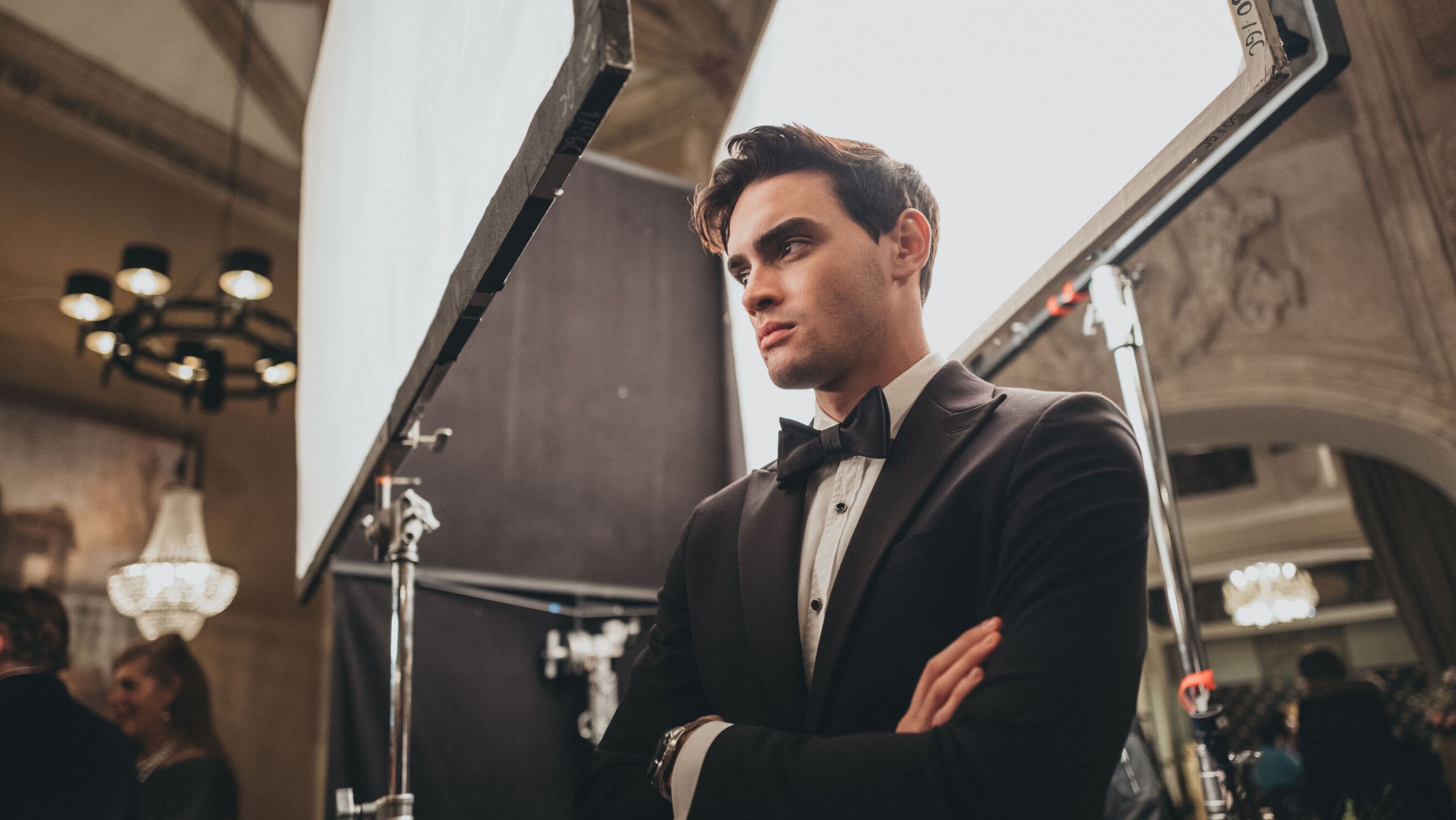 Stylish man in tuxedo at elegant event venue