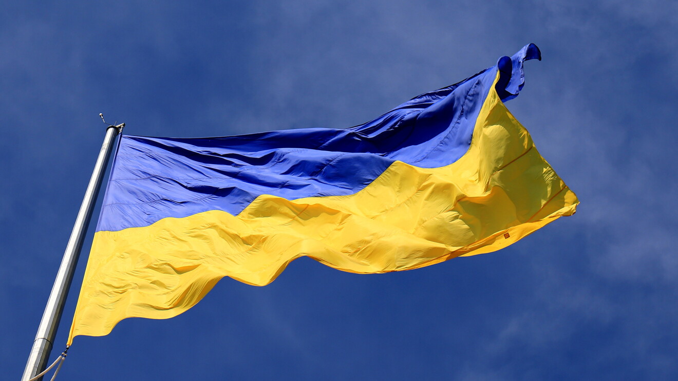 Ukraine flag against a blue sky