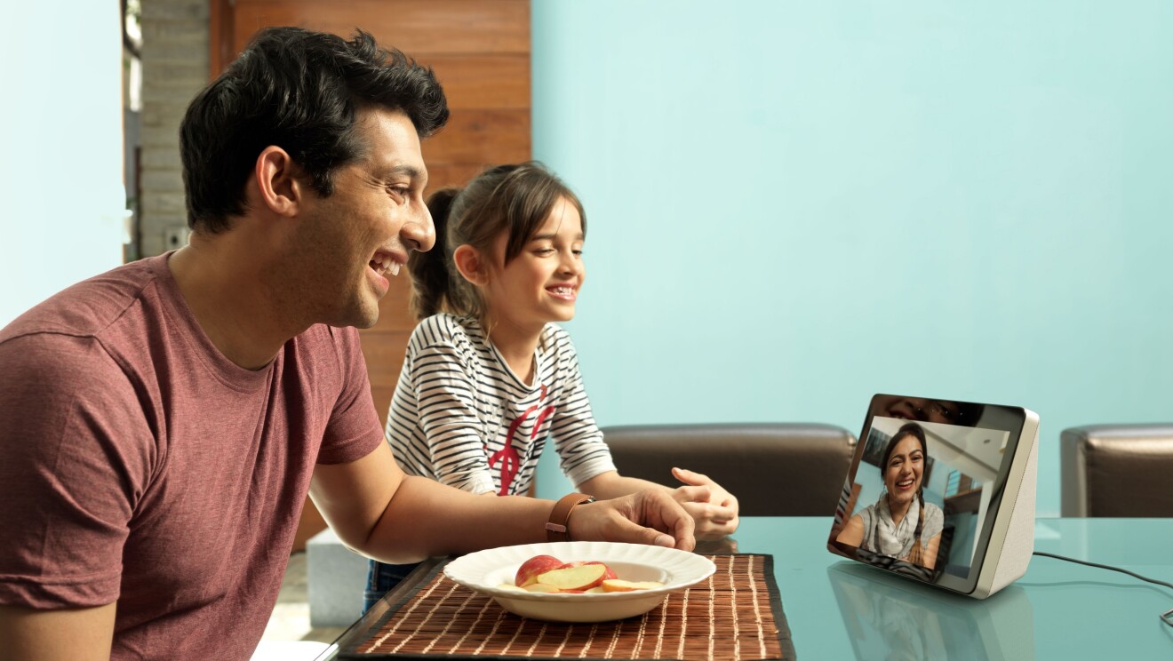 A man and a little girl (maybe father and daughter), speak to a lady (maybe the girl's mother), on an Echo show device