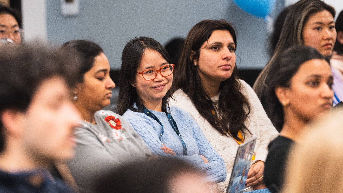 women speaking at event 