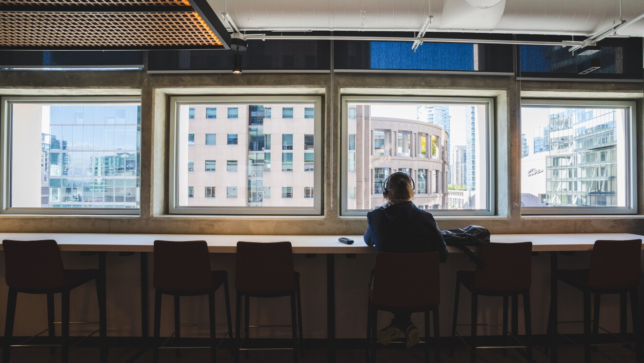 Employee sits at desk at the Post