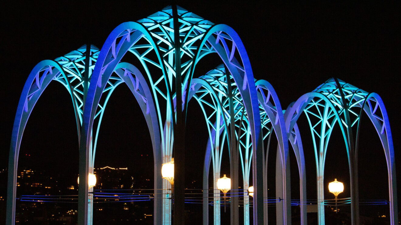 Photos of the Pacific Science Center (PacSci) arches with blue lights at night