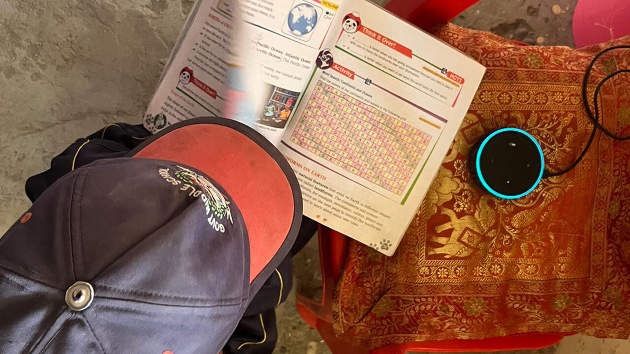 A student cross-checking Alexa's responses to general knowledge questions from his textbook
