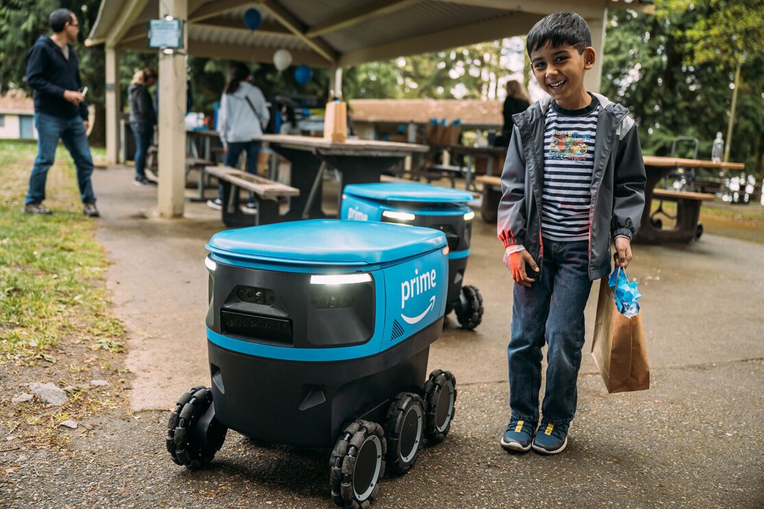 An image of Amazon Scout with families at an event.