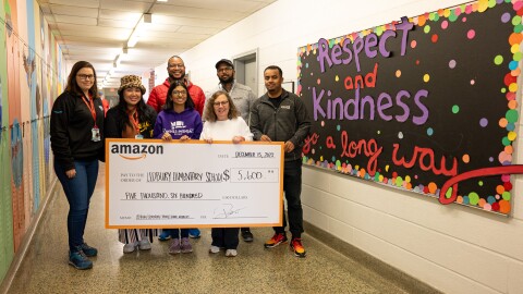 Amazon Staff presenting donations to Ledbury Park Elementary and Middle School