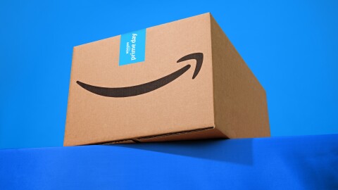 An Amazon delivery box against a blue background