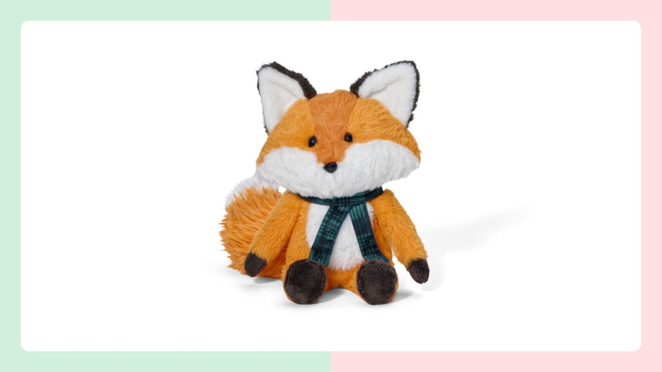 A plush fox stuffed animal toy with soft orange and white fur