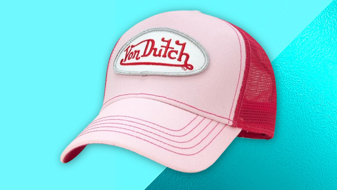 Von Dutch trucker hat against a teal blue backdrop.