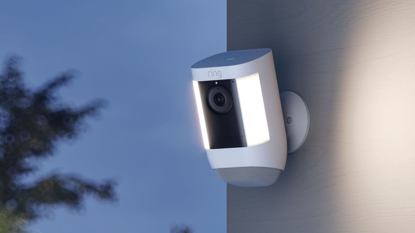 Ring security camera mounted on exterior wall at dusk