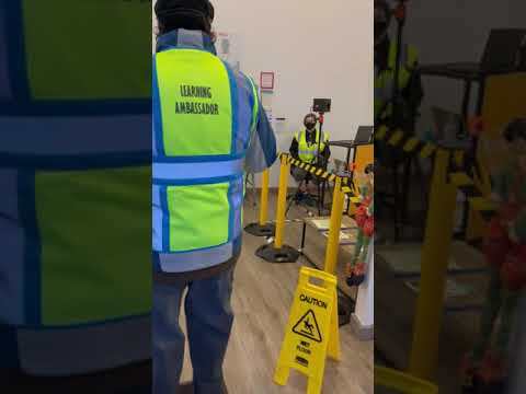 Amazon employee gets a temperature check when arriving at work