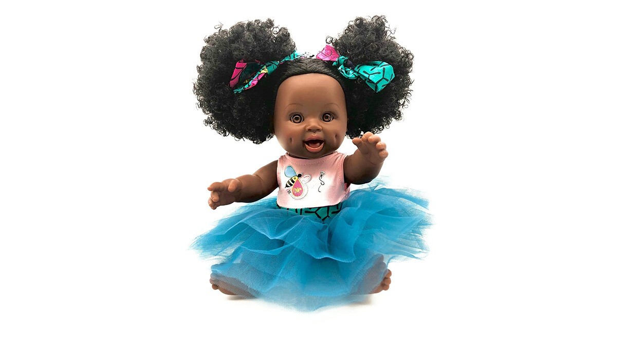 An image of a baby doll with a large blue tutu on