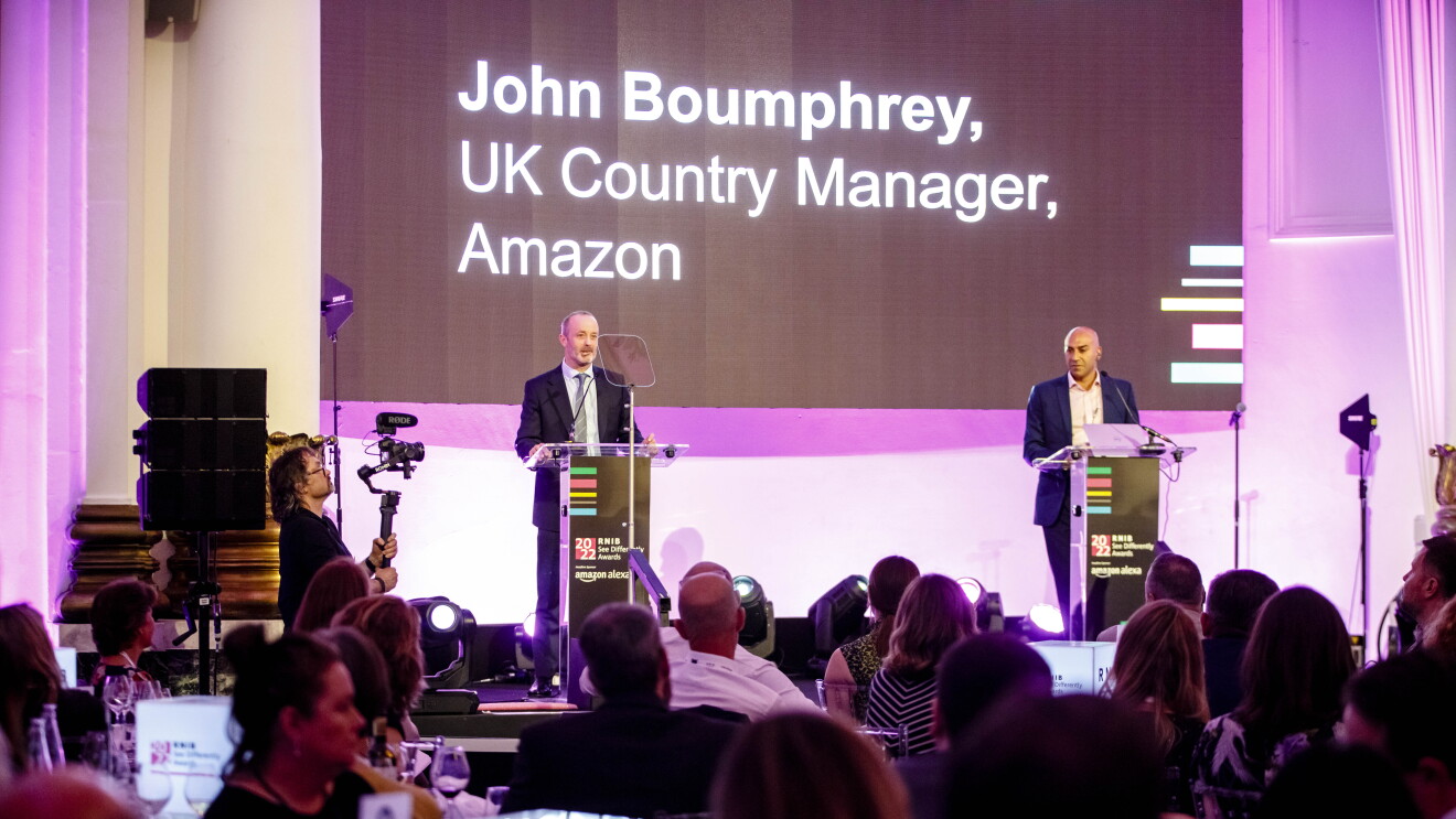 John and Amar on stage at the RNIB Awards