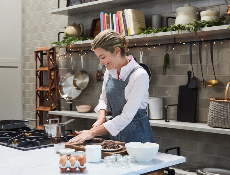 An image of KDP cookbook author, Virginie Degryse, cooking in her home kitchen.