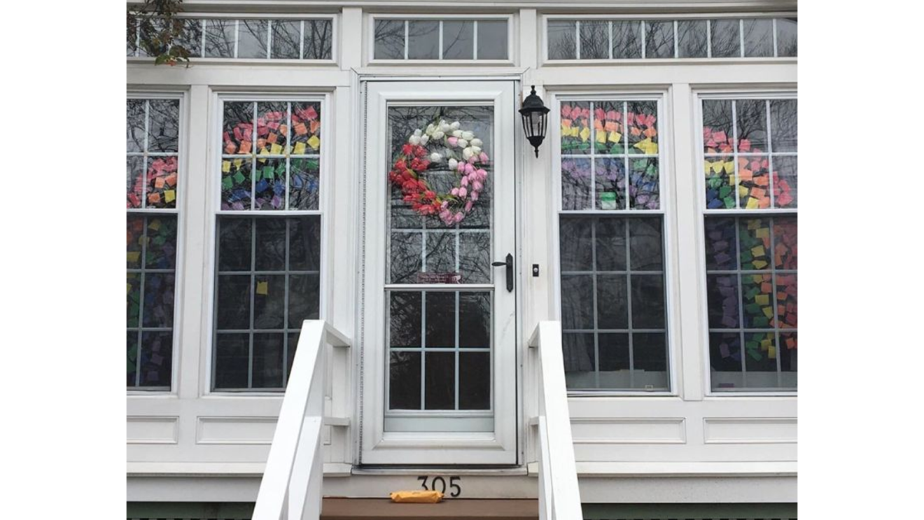Rainbows displayed in windows, created by children, as a means to thank essential workers during the COVID-19 pandemic